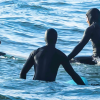 Sea otter clambers onto surfboard in BC, prompting warning